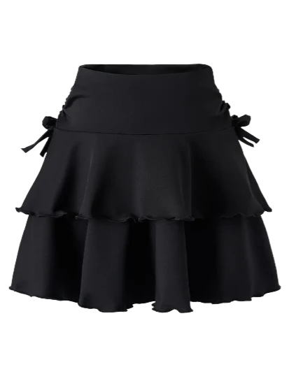 Falda negra elegante – Volumen en capas y moño chic
